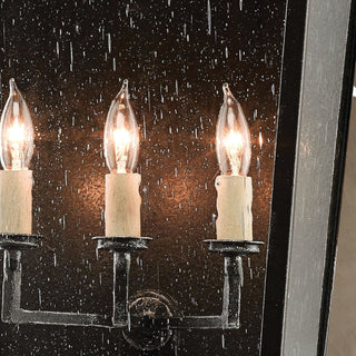 LUMENS LAMP Bening 大型户外壁灯，采用午夜黑色锻铁框架和透明种子玻璃，配有三个烛台灯泡。